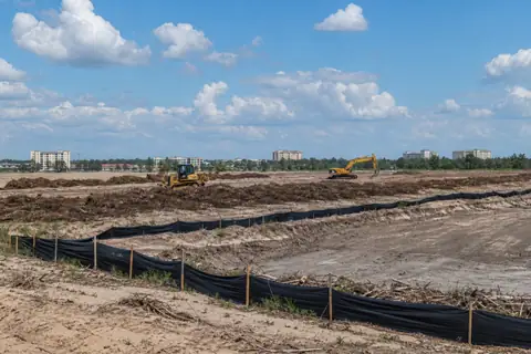 Commercial parcel opened for survey, drainage, and pad preparation